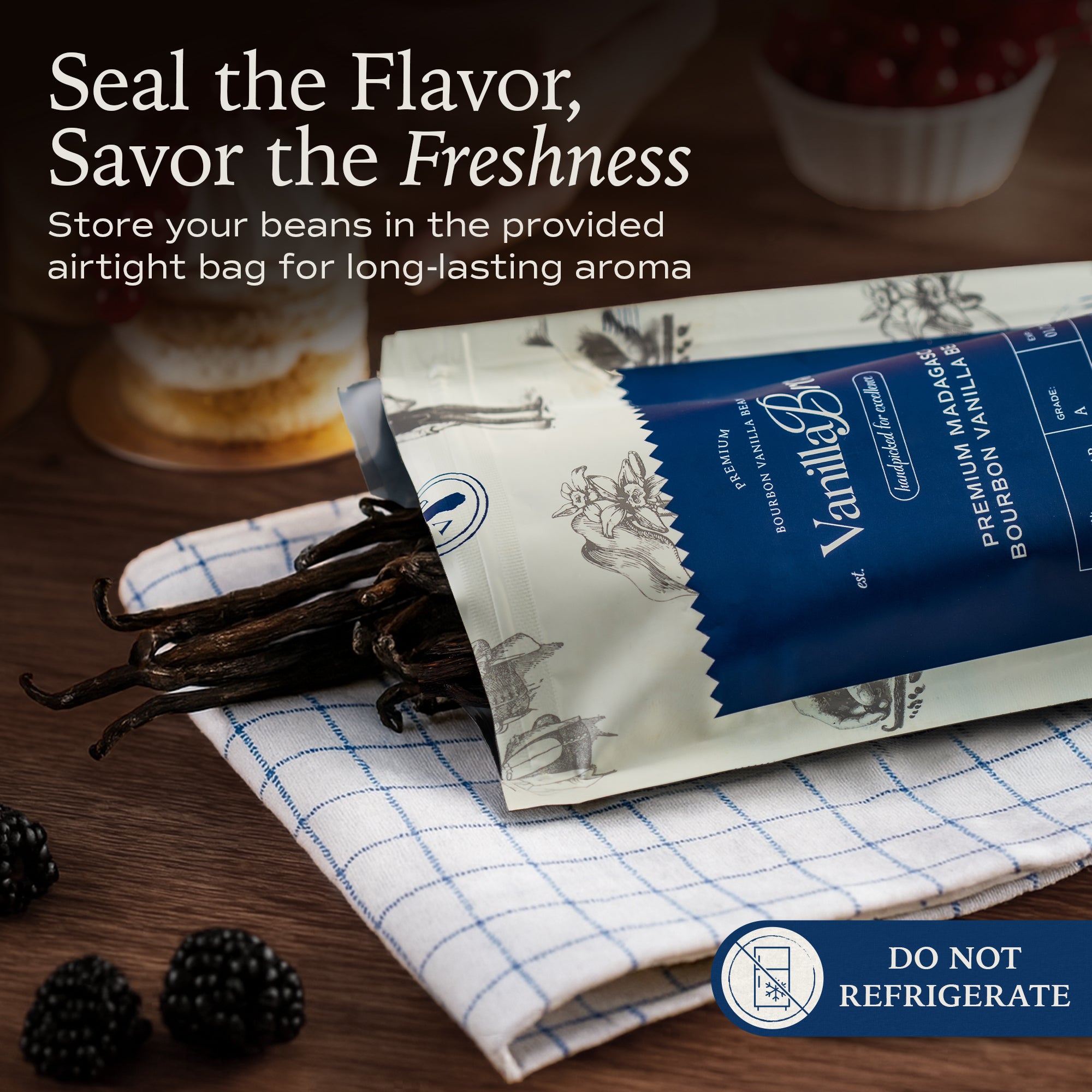 VanillaBros Premium Madagascar Bourbon vanilla beans spilling from airtight resealable packaging on linen cloth with blackberries — store at room temperature